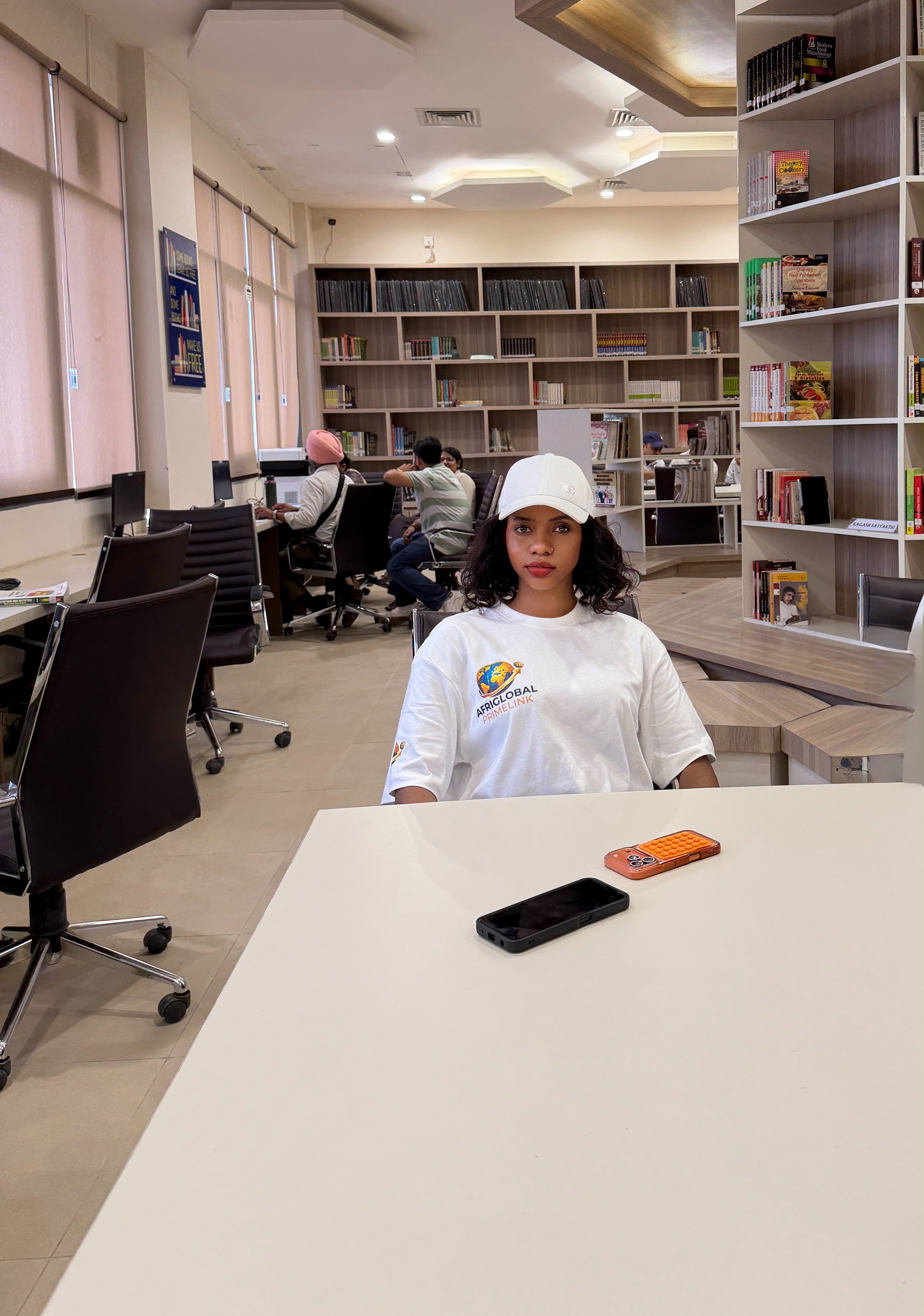 An AfriGlobal representative seated in the CGC library reading area