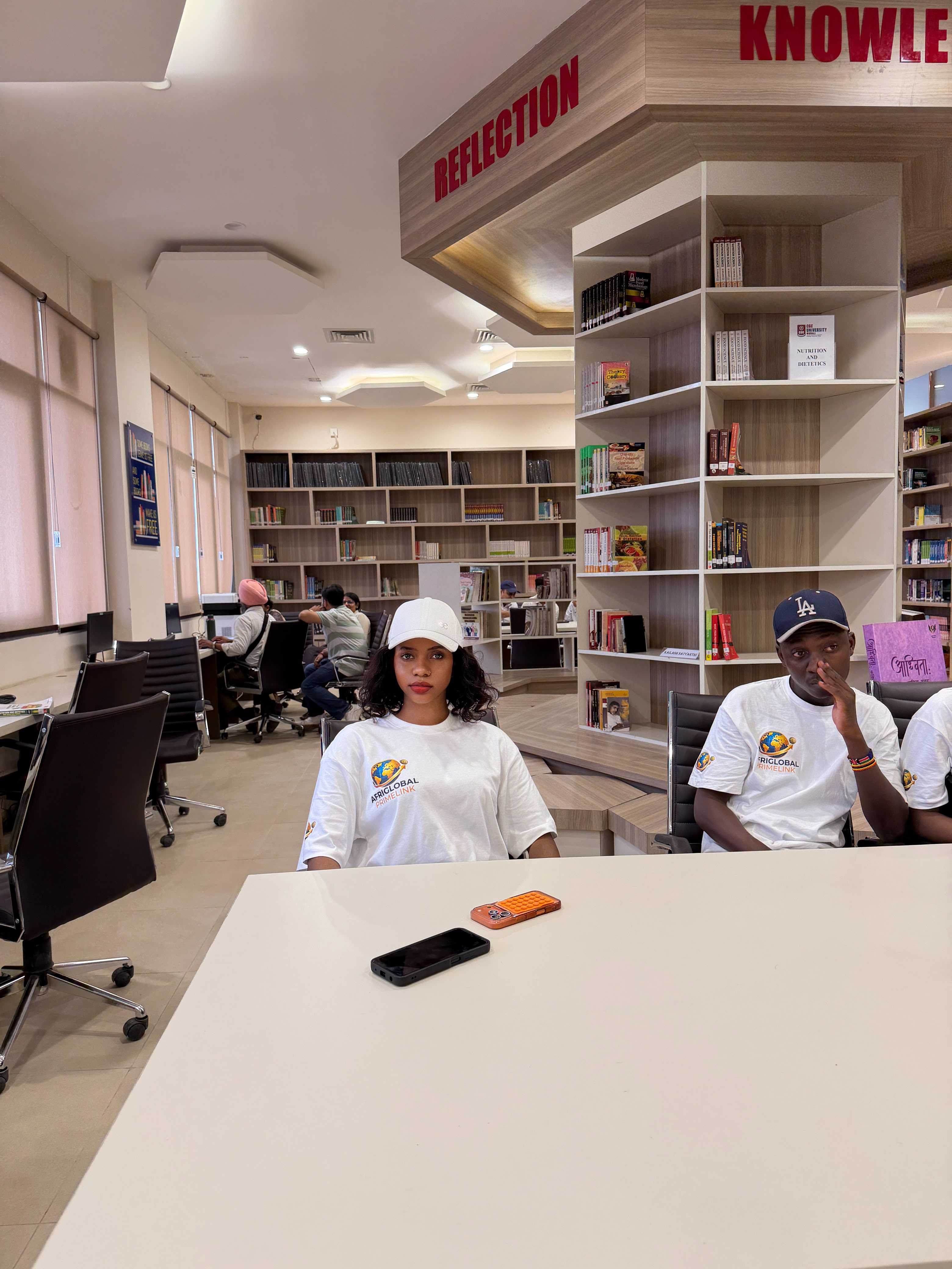 AfriGlobal representatives at a study table in the CGC library