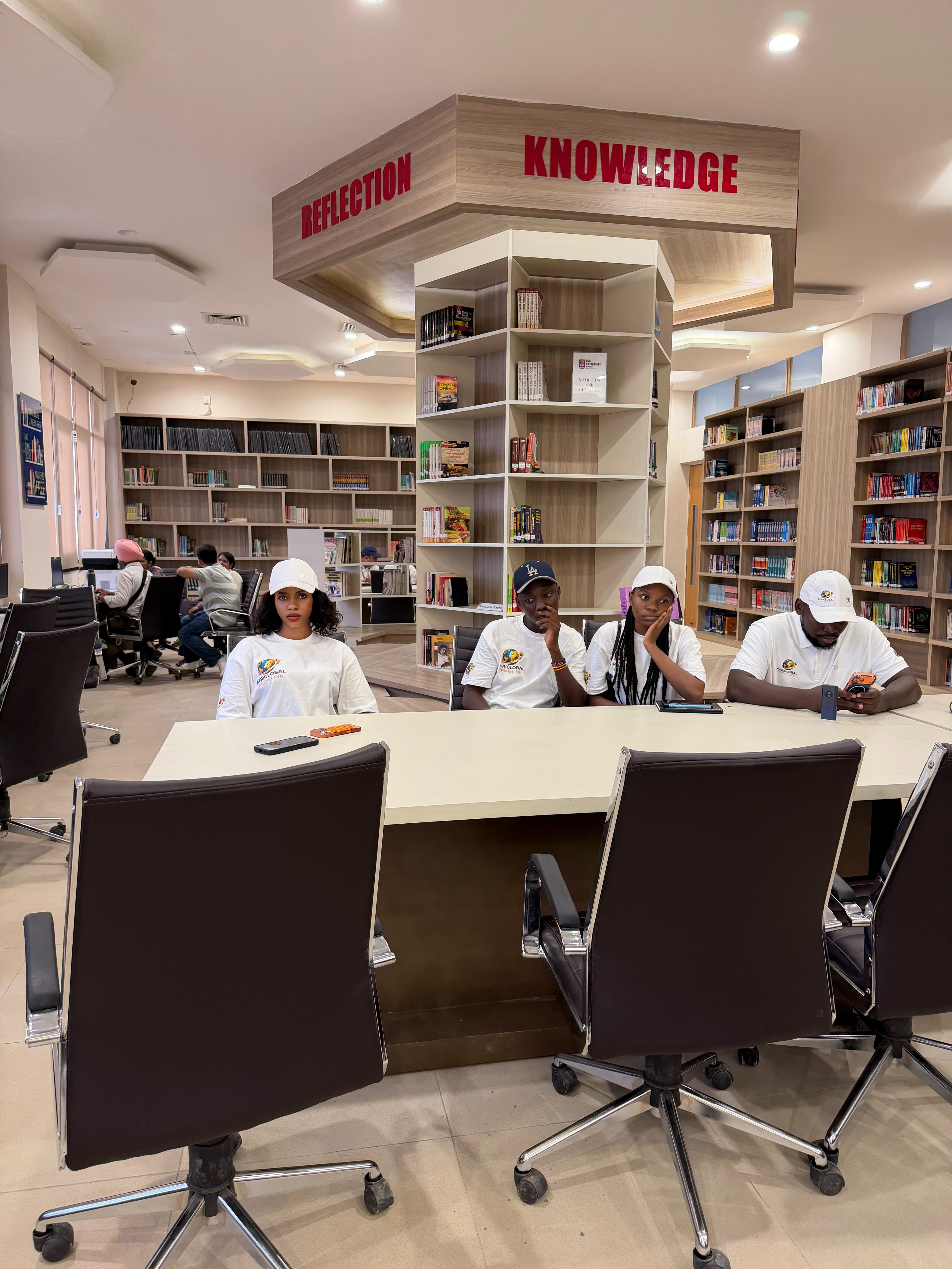 AfriGlobal representatives at a table in the CGC library