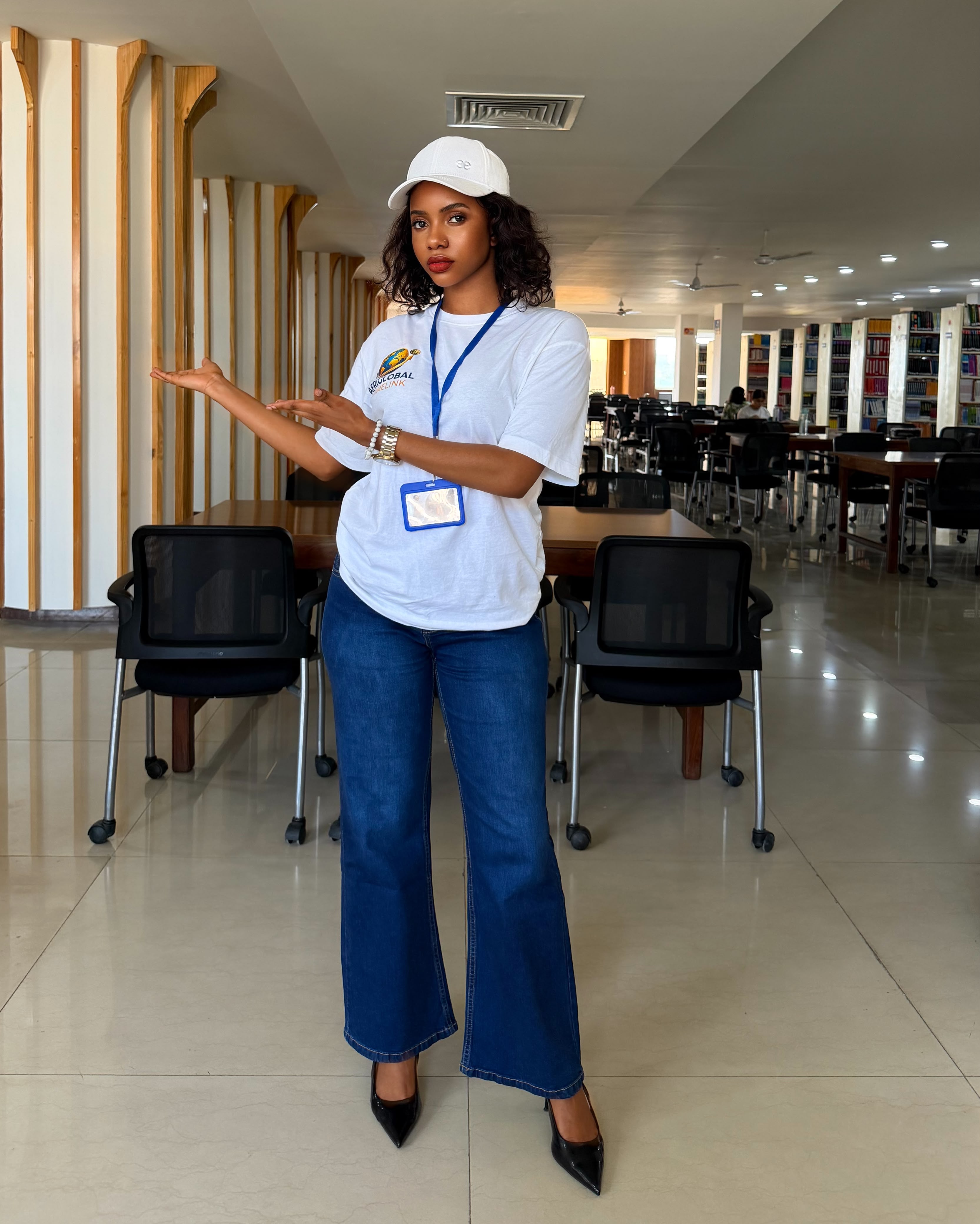 An AfriGlobal representative in the MM University library reading hall