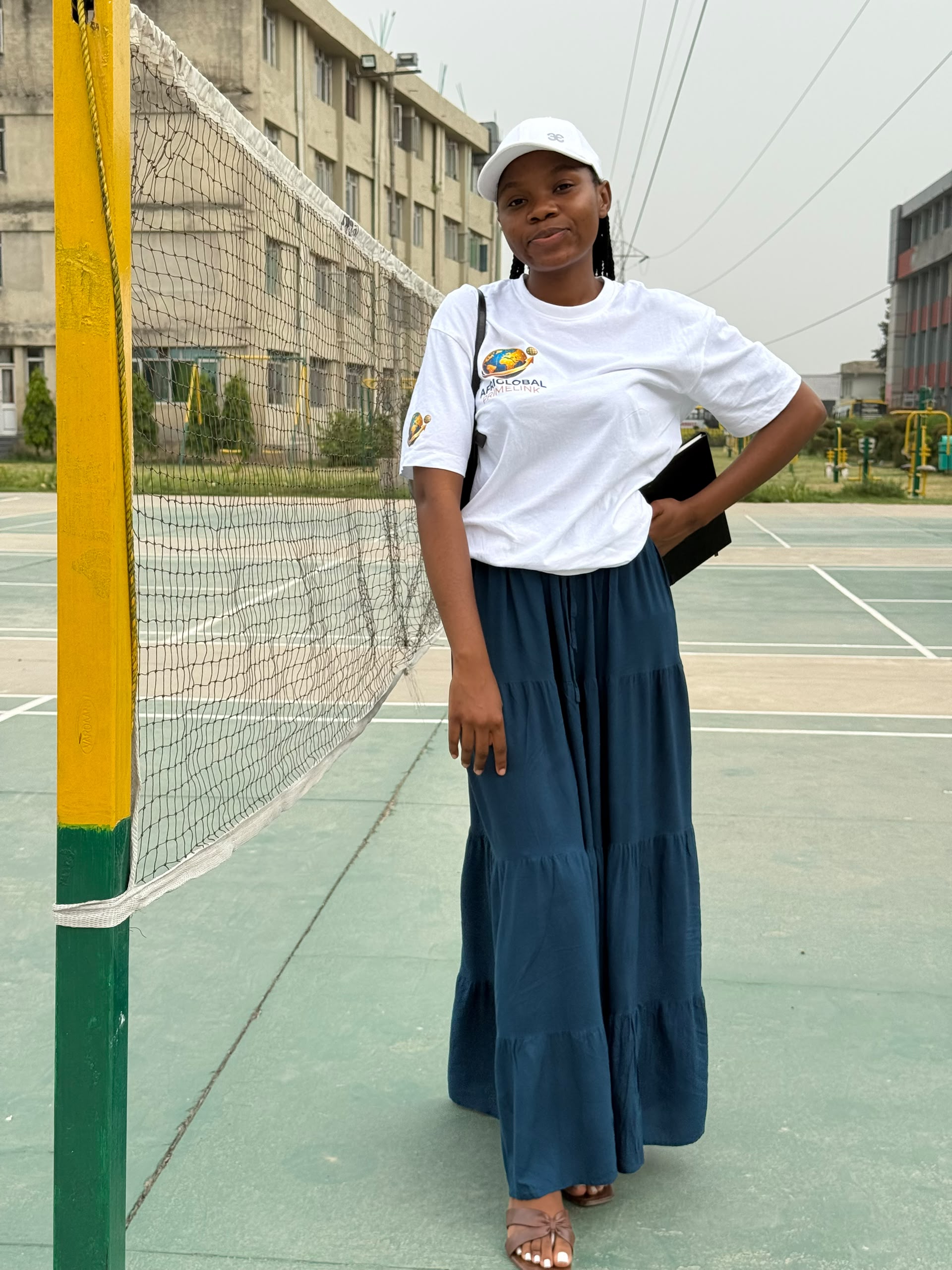 An AfriGlobal representative on the outdoor sports court at Rayat Bahra University