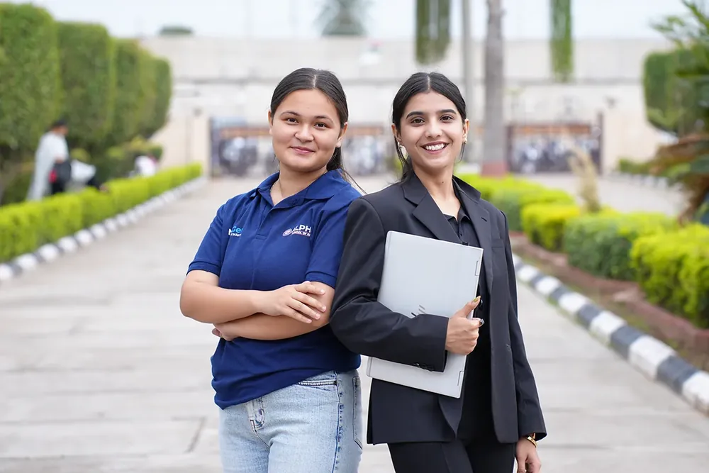 Students on a tree-lined path at Rayat Bahra University